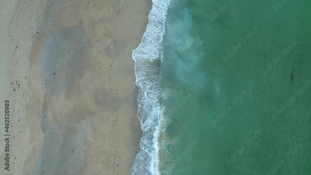 Aerial view of a beautiful beach with calm ocean water near Zennor Cove in Cornwall, Saint Ives, United Kingdom. Aerial view of a beautiful beach with calm ocean water near Zennor Cove in Cornwall, Saint Ives, United Kingdom.
