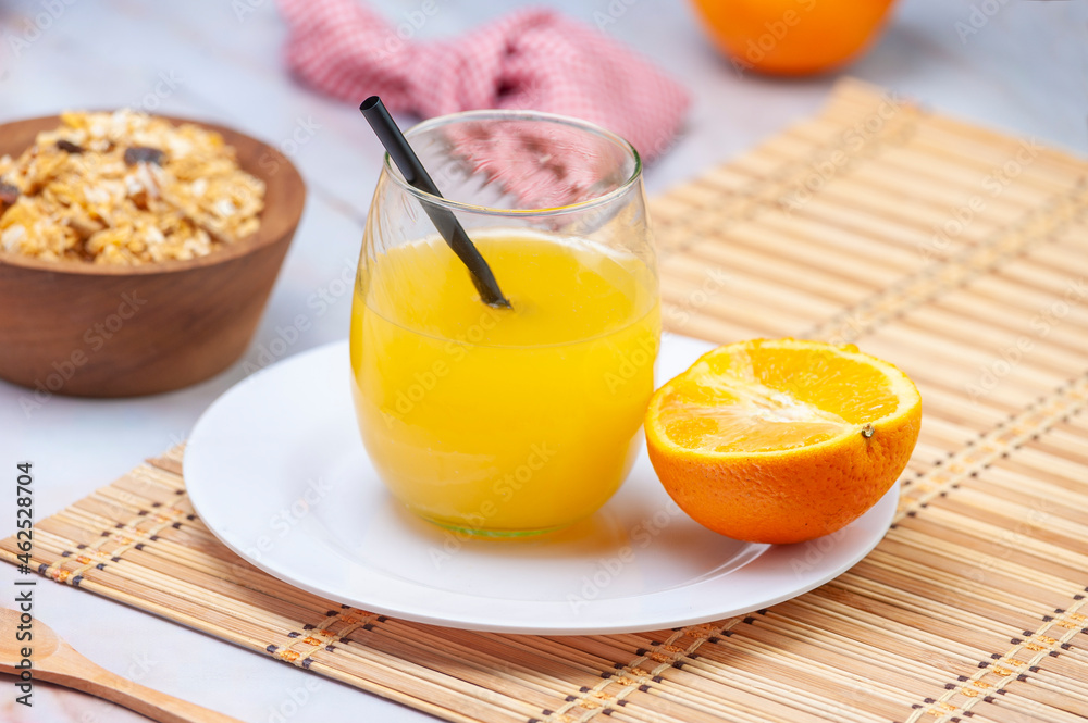 fresh orange juice with whole orange cereals for breakfast or a snack on marble bottom fresh orange juice with whole orange cereals for breakfast or a snack on marble bottom