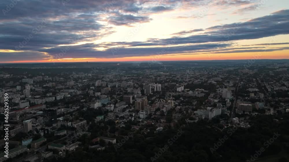 Aerial drone view of Chisinau downtown at sunset. Panorama view of multiple buildings, roads, lush trees. Moldova Aerial drone view of Chisinau downtown at sunset. Panorama view of multiple buildings, roads, lush trees. Moldova