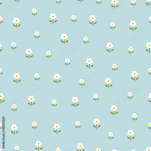 Seamless pattern small flower background randomly placed on blue background hand drawn design in cartoon style Used for prints, wallpapers, fabrics, textiles Vector illustration.