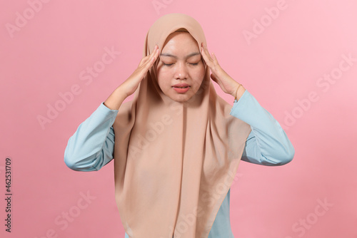 Young Muslim Woman having a headache