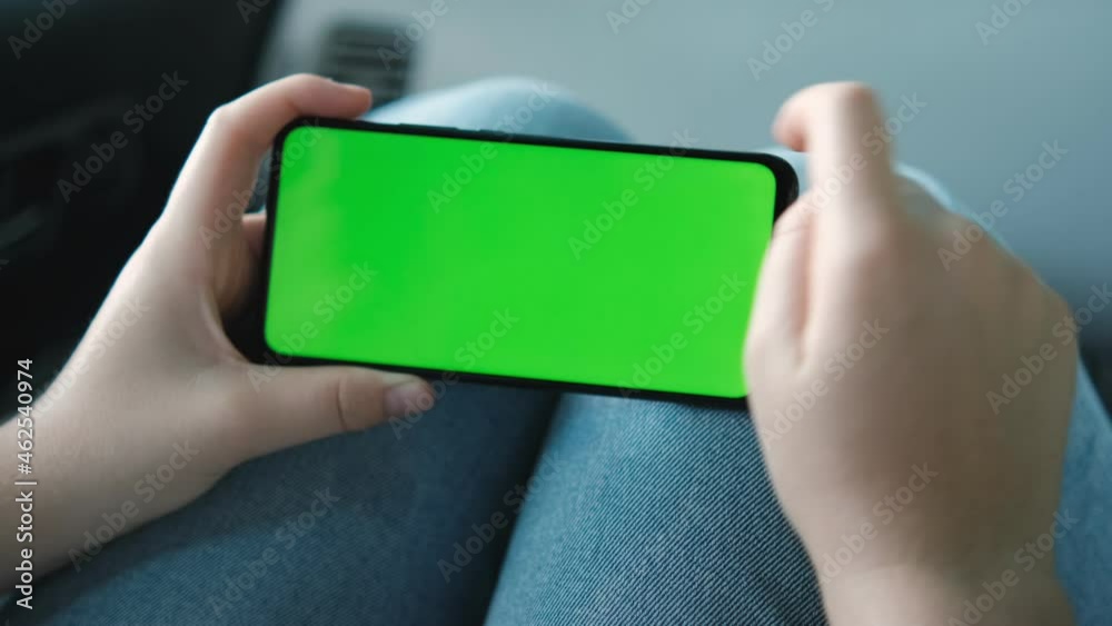20s Lady Watching Video News in car Close up. 20s Lady Watching Video News in car Close up.