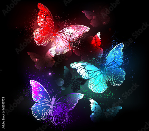 Three glowing butterflies