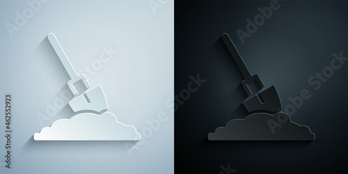Paper cut Shovel in the ground icon isolated on grey and black background. Gardening tool. Tool for horticulture, agriculture, farming. Paper art style. Vector