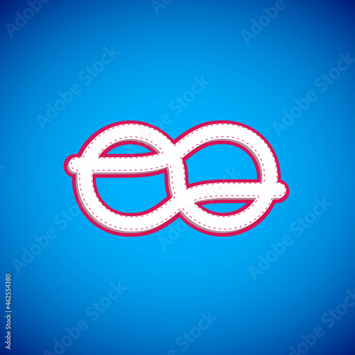 White Nautical rope knots icon isolated on blue background. Rope tied in a knot. Vector