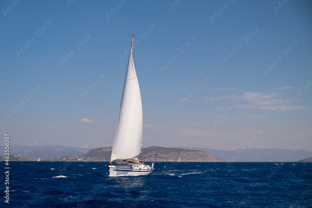 Catamaran sail Yacht cruising on deep blue sea water