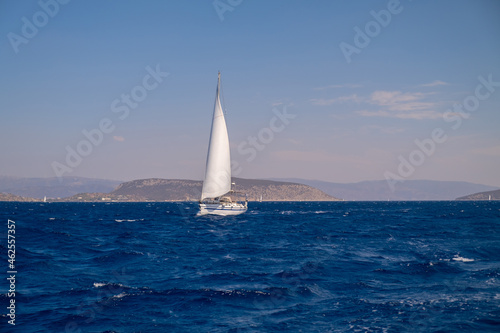 Catamaran sail Yacht cruising on deep blue sea water © Anatoly Repin