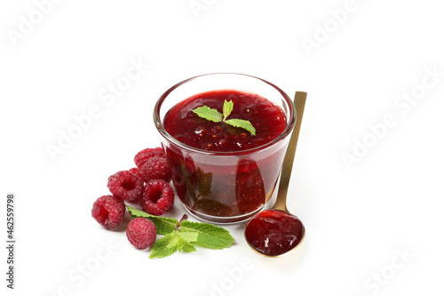 Glass bowl of raspberry jam isolated on white background