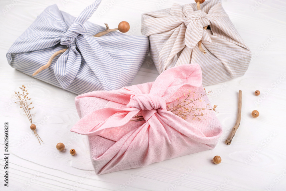 Christmas furoshiki wrapping. Zero waste concept. Flat lay. Christmas furoshiki wrapping. Zero waste concept. Flat lay.