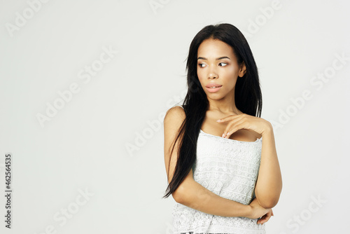 cute african american woman in white tank top fashion hairstyle cosmetics studio