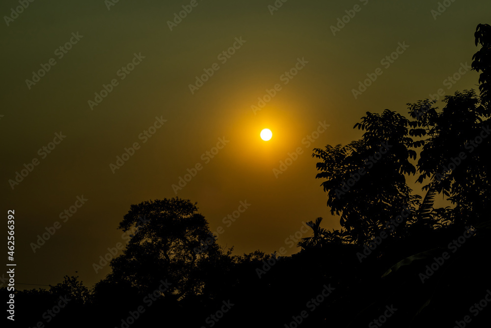 Fototapeta premium The beautiful sunset over the forest into the village and sundown is one of his most famous moment for everyone