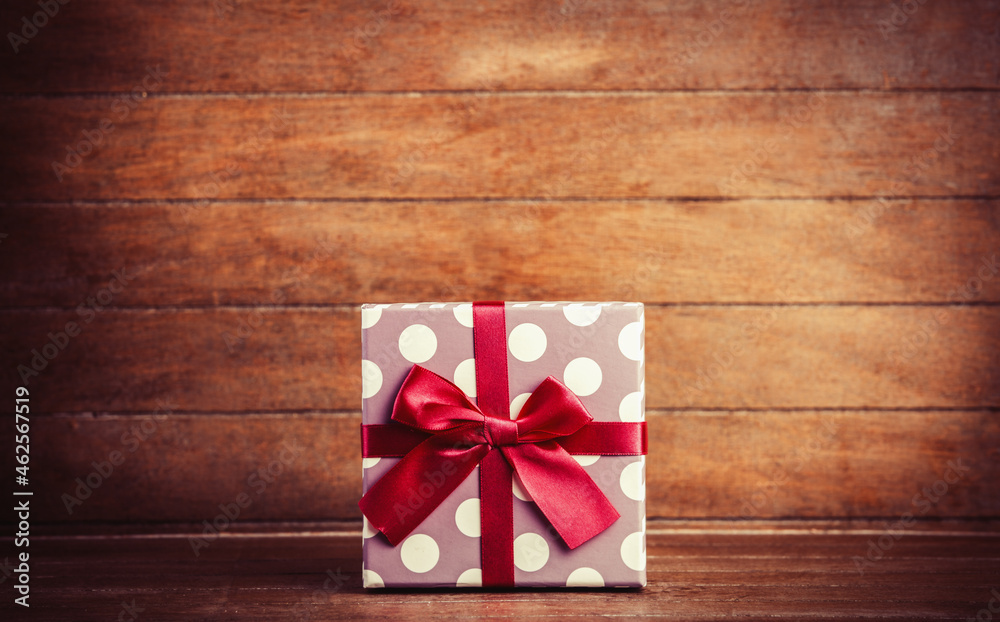 Retro gift on wooden table.