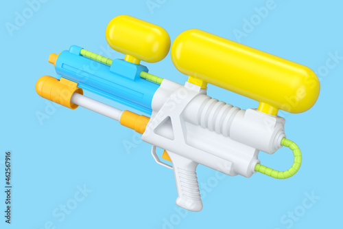 Plastic water gun toy for playing in the swimming pool isolated on blue