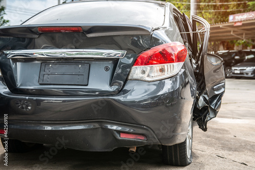 Car crashes are dangerous from car accidents on city roads, damaged cars, dented, torn, damaged paint. A temporary solution to the problem by tying up the damaged part allows the journey to continue © tai