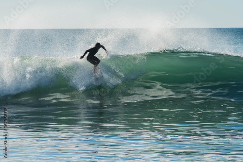 confirmed surfer in action in big waves