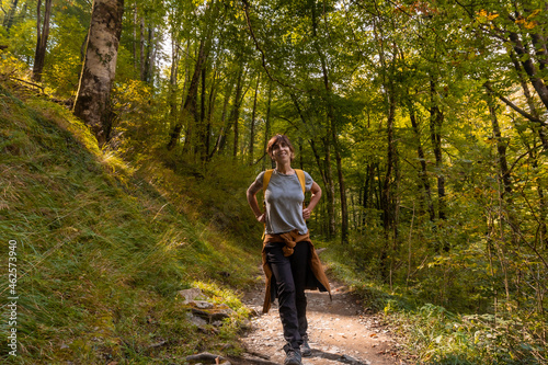 A young woman heading to Passerelle de Holtzarte de Larrau in the forest or jungle of Irati, northern Navarra in Spain and the Pyrenees-Atlantiques of France © unai
