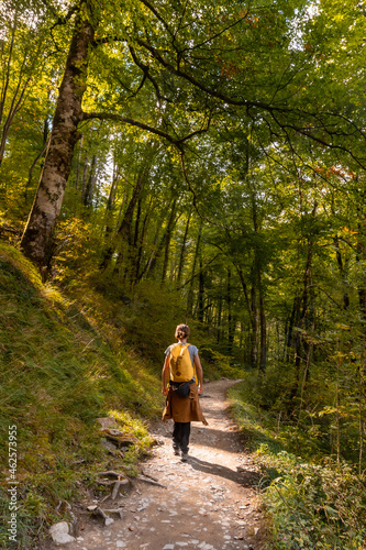 A young woman heading to Passerelle de Holtzarte de Larrau in the forest or jungle of Irati, northern Navarra in Spain and the Pyrenees-Atlantiques of France photo