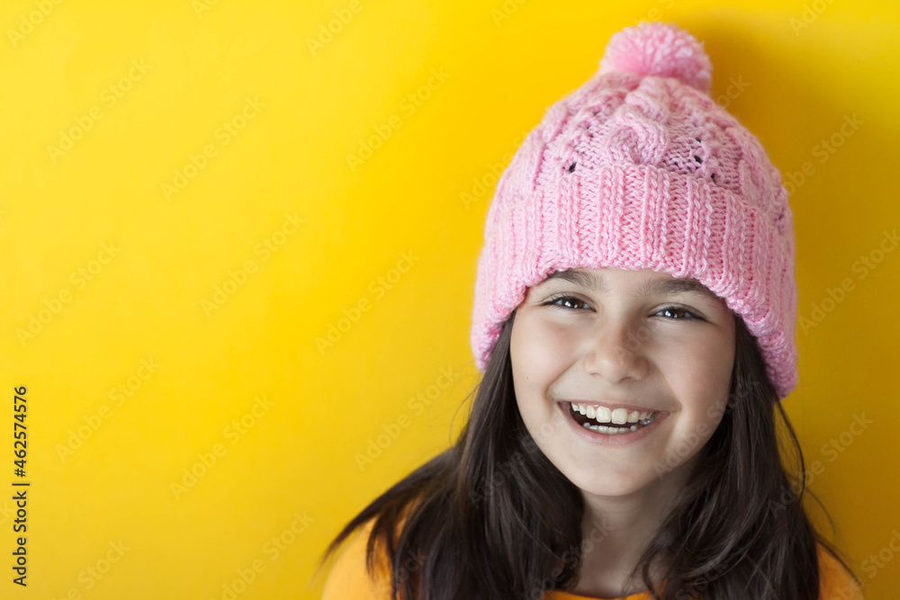 Happy beautiful smiling child girl in knitted hat. Space for text. Autumn consept. Happy beautiful smiling child girl in knitted hat. Space for text. Autumn consept.