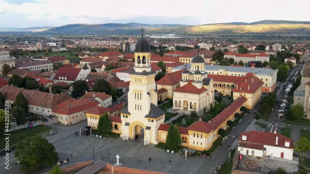 Aerial drone view of Alba Carolina Citadel in Alba-Iulia, Romania. Cityscape, multiple buildings, church, people Aerial drone view of Alba Carolina Citadel in Alba-Iulia, Romania. Cityscape, multiple buildings, church, people