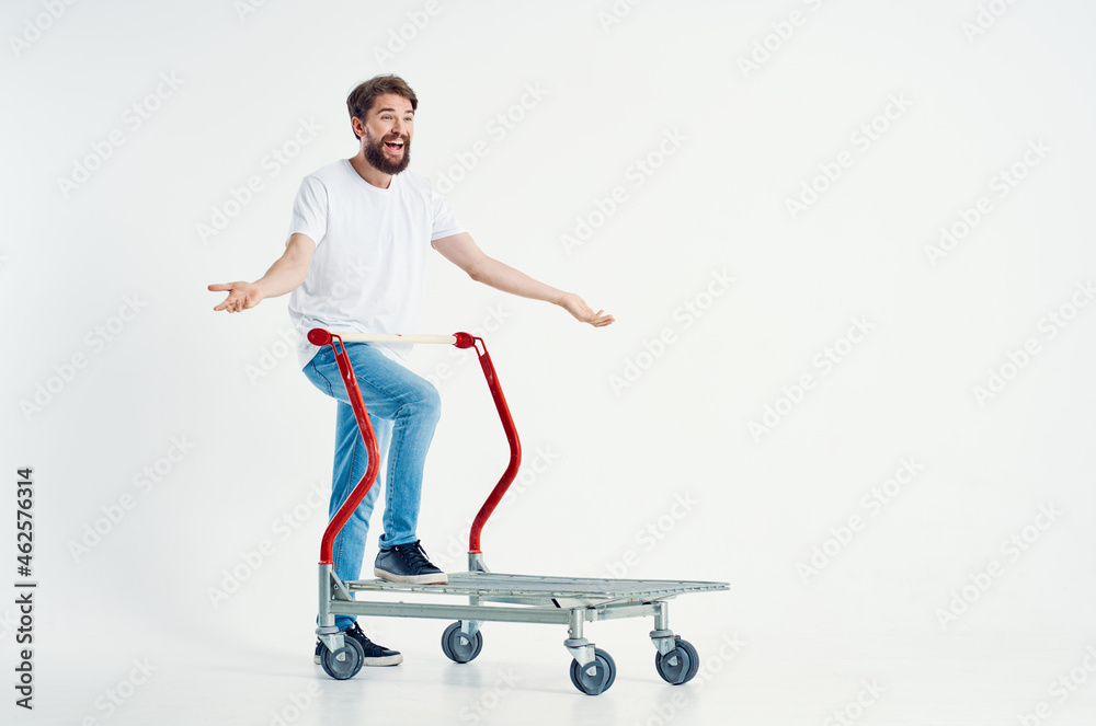 Man ride a cart entertainment shipping light background Man ride a cart entertainment shipping light background