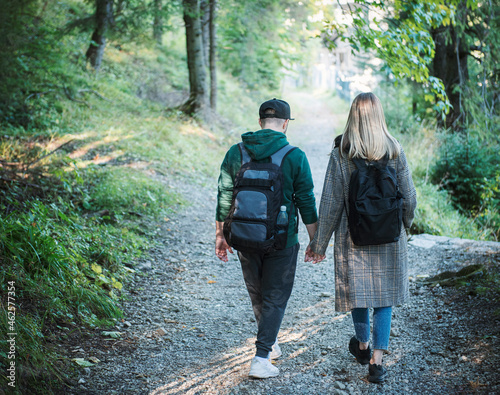 Traveler couple in love enjoying in the forest. Freedom and active lifestyle concept.