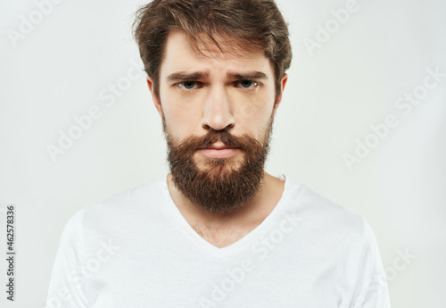 Man in a white t-shirt expressive look discontent Lifestyle