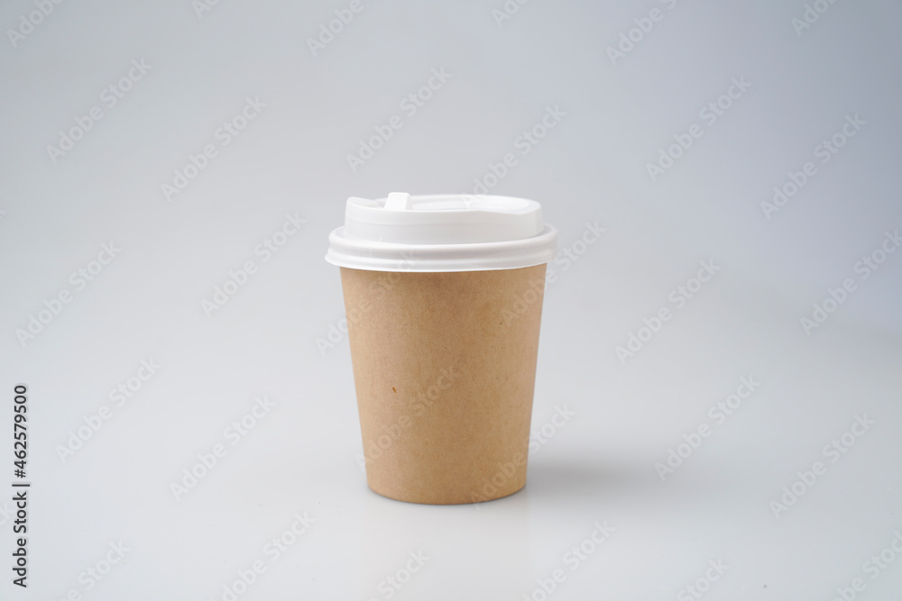Front view of empty a cup of coffee craft paper disposable mock up on white background. Delivery food concept. Front view of empty a cup of coffee craft paper disposable mock up on white background. Delivery food concept.