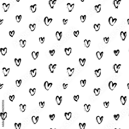 Vector pattern with black hearts. Linear silhouettes of hearts hand-drawn in charcoal. Romantic ink illustration. Black-white seamless pattern for Valentine's Day. Simple repeating chaotic texture.