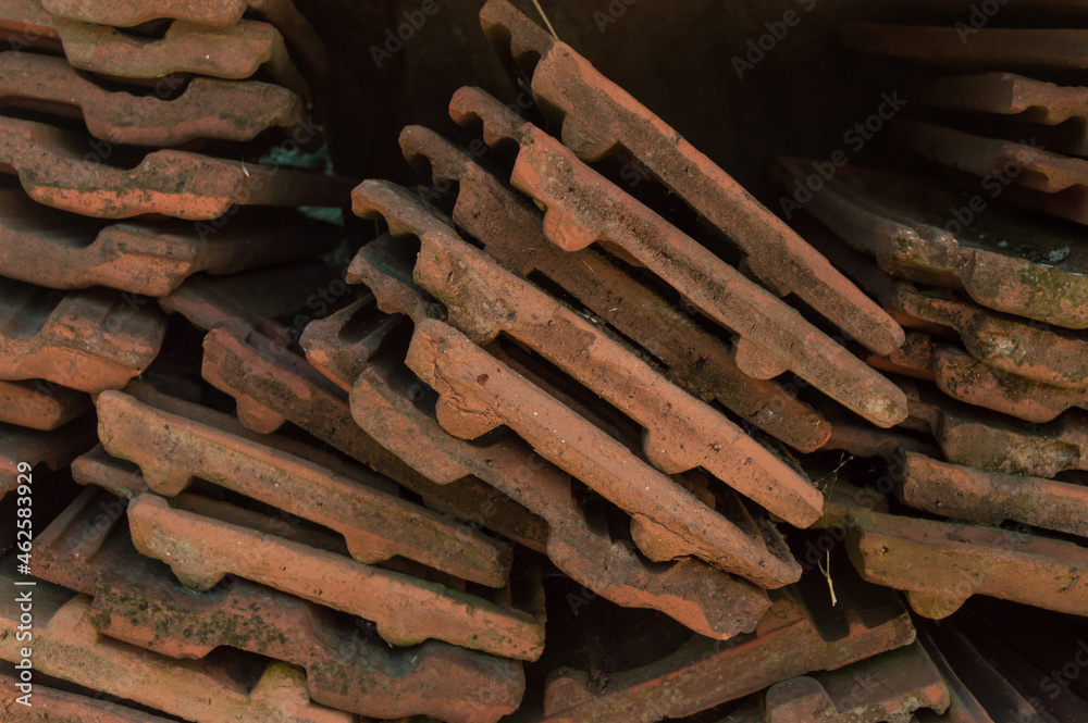 Old red roof tiles. Background of clay tiles