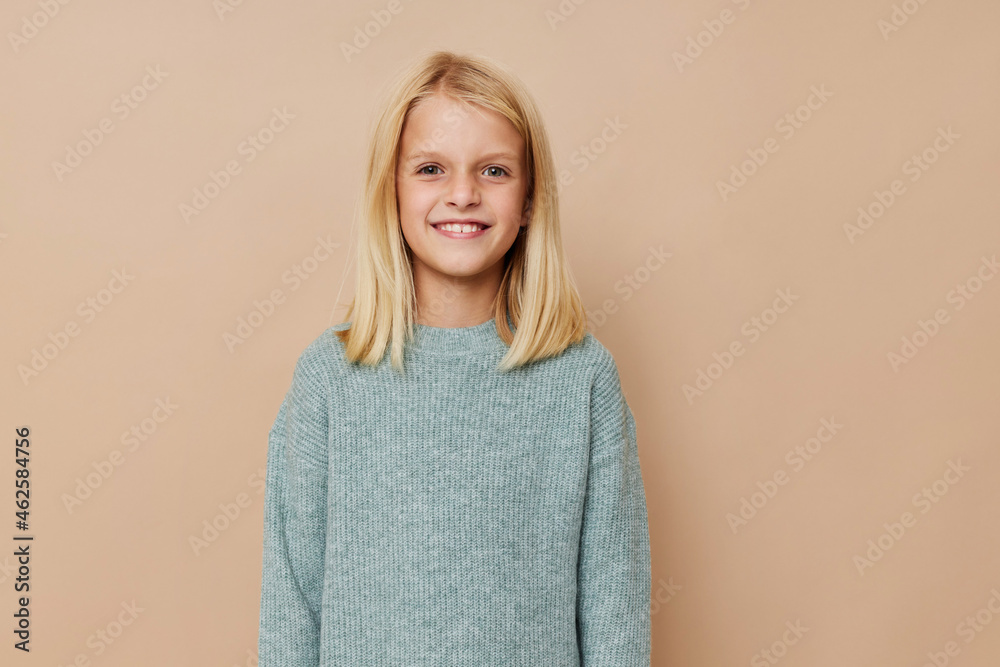 Positive little girl with blond hair posing studio Positive little girl with blond hair posing studio