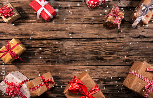 Christmas gifts on wooden b...