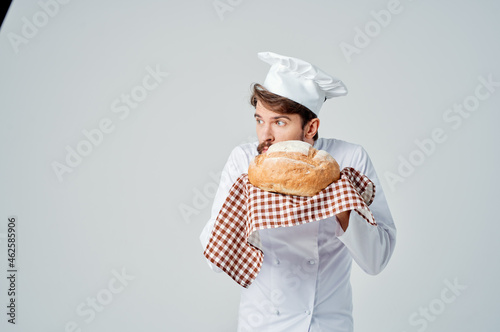 male cook with bread in hand isolated background