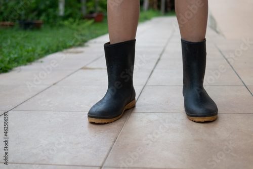 woman legs wear farming boots for agriculture or gardening lifestyle concept © Lerluck