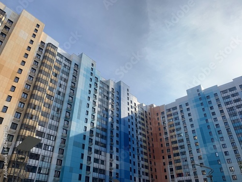 architecture buildings sky road line pathway walkway day clear blue sky colored buildings houses high-rise buildings industrial