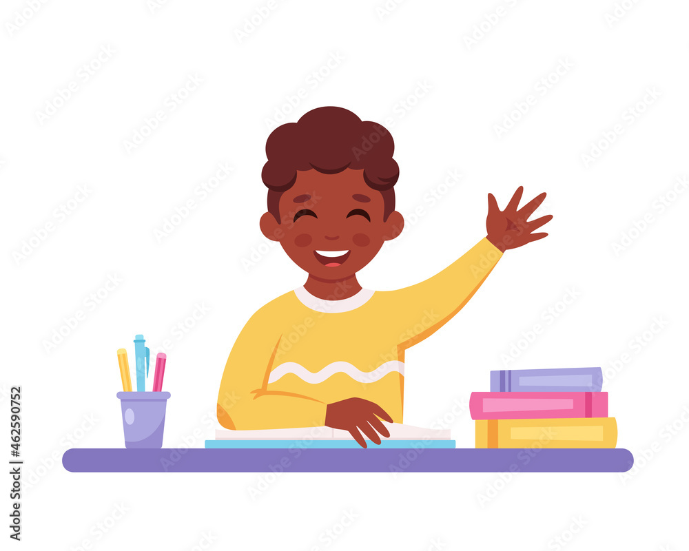 Boy raising hand to answer. Child sitting at a desk with school supplies. Elementary school student. Vector illustration