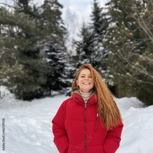 Smiling woman in winter forest