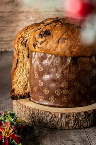 Traditional Italian panettone for Christmas on wooden table 