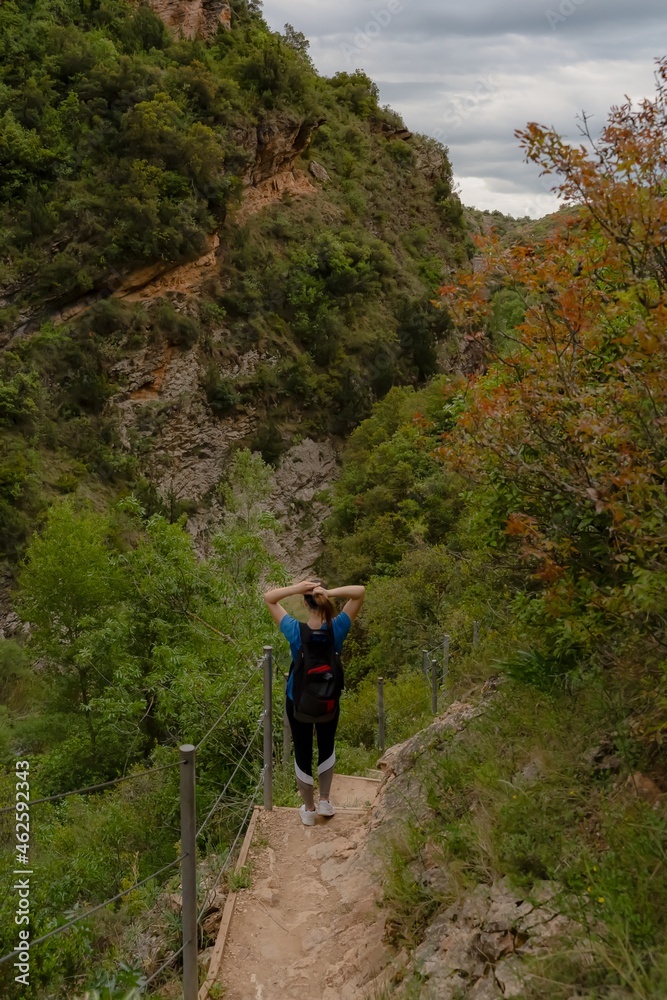 Girl picking her hair up in nature