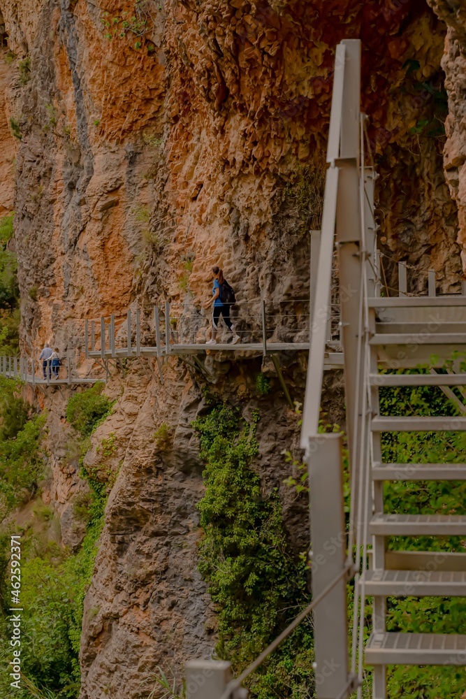Girl moving up the iron walkways