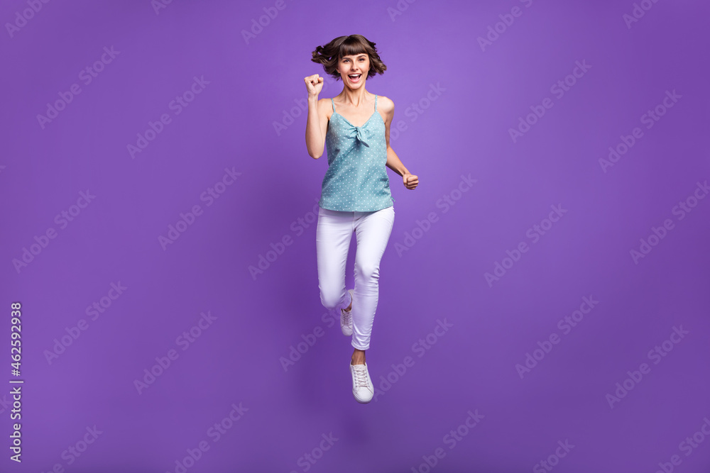 Full length body size view of attractive cheerful girl jumping running isolated over bright violet purple color background