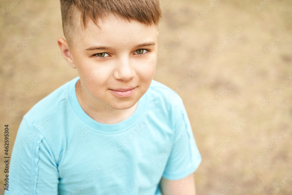 Little boy outdoor portrait. Happy baby face. Male person at backyard. American smart schoolboy. Positive child expression. Smile kid face. Summer time Little boy outdoor portrait. Happy baby face. Male person at backyard. American smart schoolboy. Positive child expression. Smile kid face. Summer time