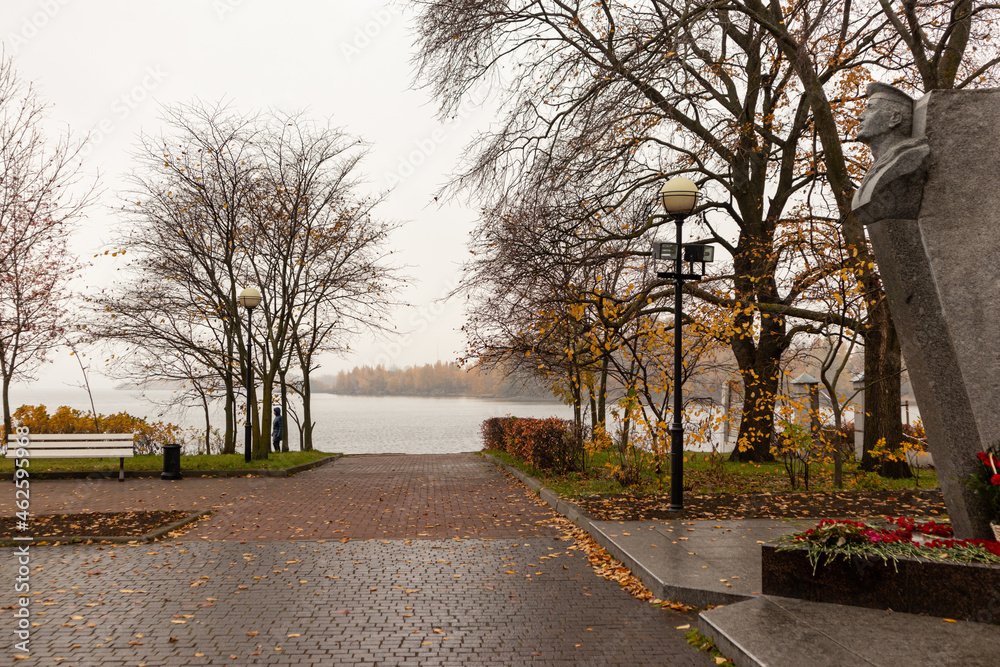 autumn park with white benches in Kronstadt with access to the Gulf of Finland