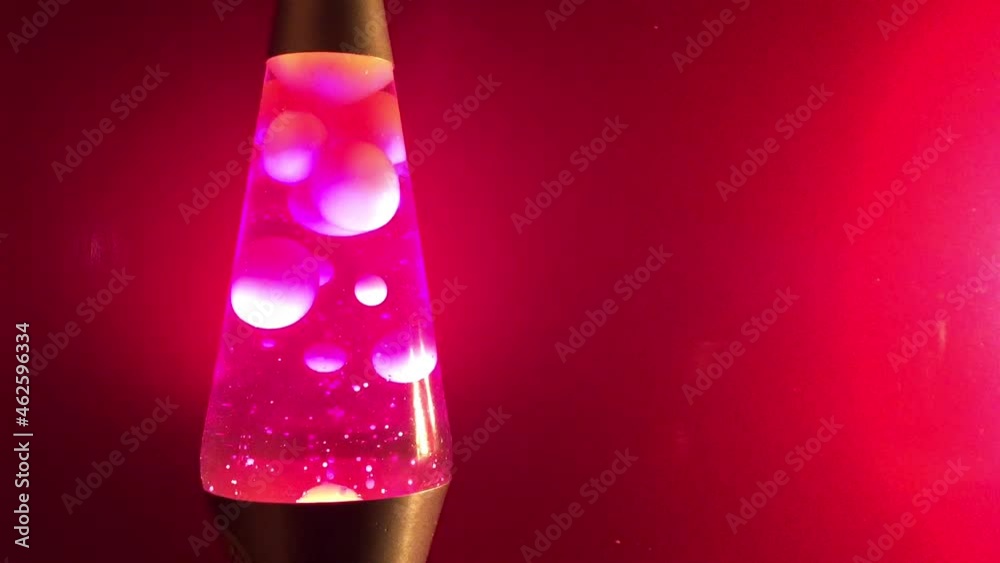pink Lava lamp closeup 70s style pink lava liquid and pink background stock footage with copy space