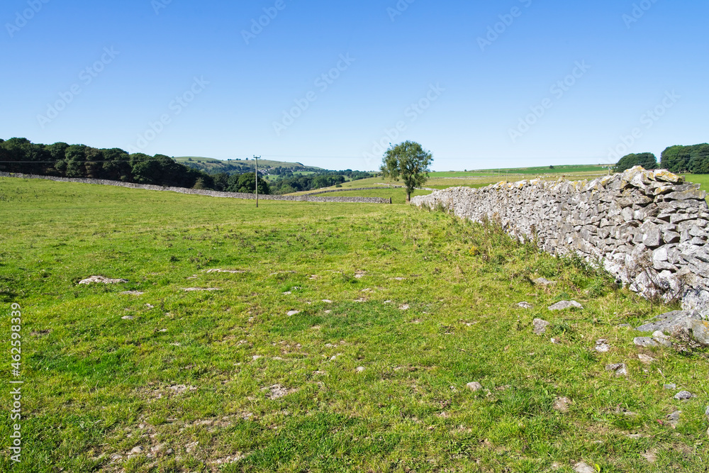 Dry stone wall leads across a field in Derbyshire