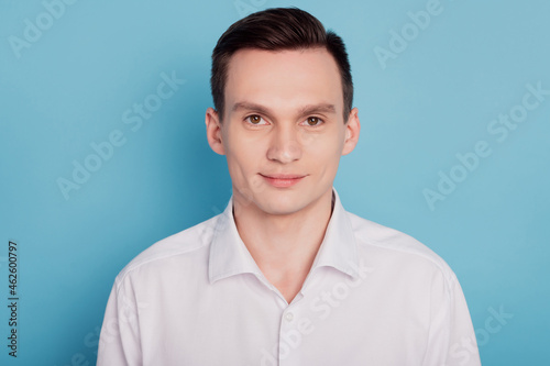 Photo of young handsome business man confident agent smart formalwear isolated over blue color background © Tetiana