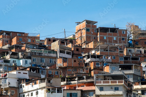 urban area with slums, simple buildings usually built on the hillsides of the city © Celso Pupo