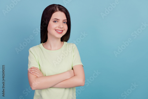 Photo of young attractive girl good mood confident clever crossed hands isolated on turquoise color background