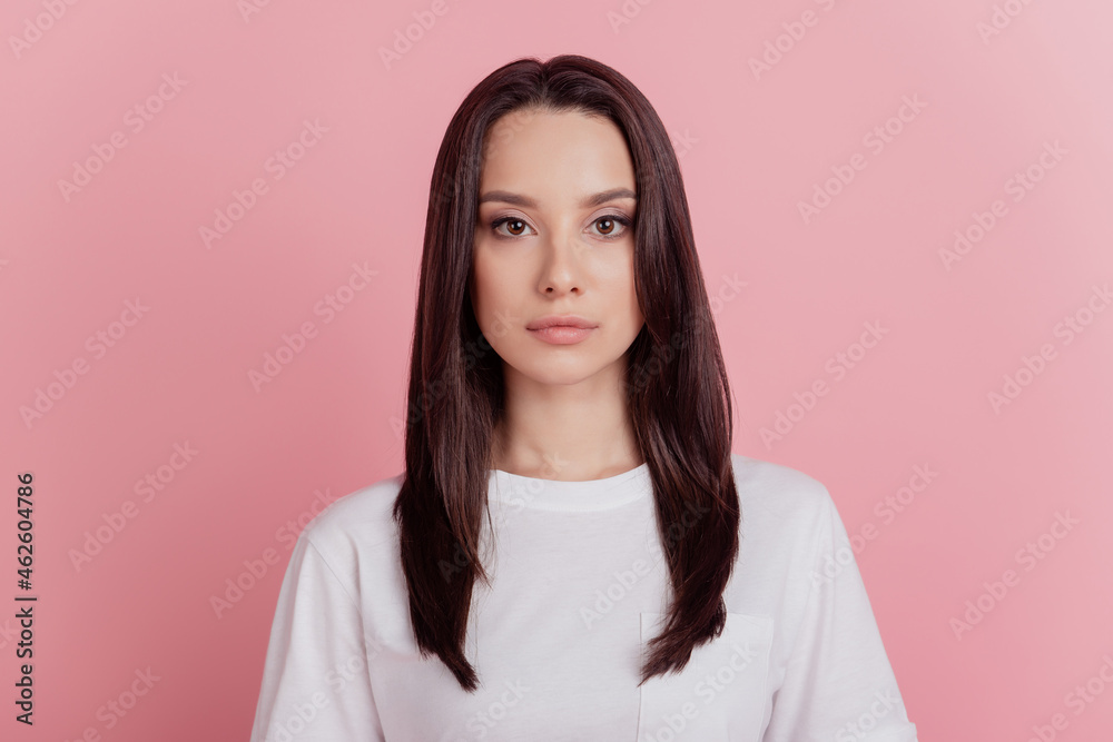 Photo of young attractive confident business woman calm agent manager isolated over pink color background Photo of young attractive confident business woman calm agent manager isolated over pink color background