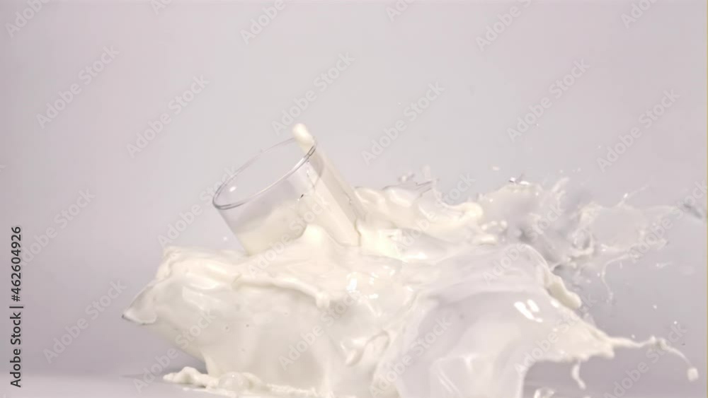 Super slow motion glass of milk explodes. On a white background. Filmed on a high-speed camera at 1000 fps.High quality FullHD footage Super slow motion glass of milk explodes. On a white background. Filmed on a high-speed camera at 1000 fps.High quality FullHD footage