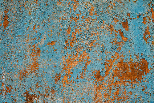 Rusty metal turquoise and red color texture background. Oxidated metal surface. Old vintage painted steel plate © irissca